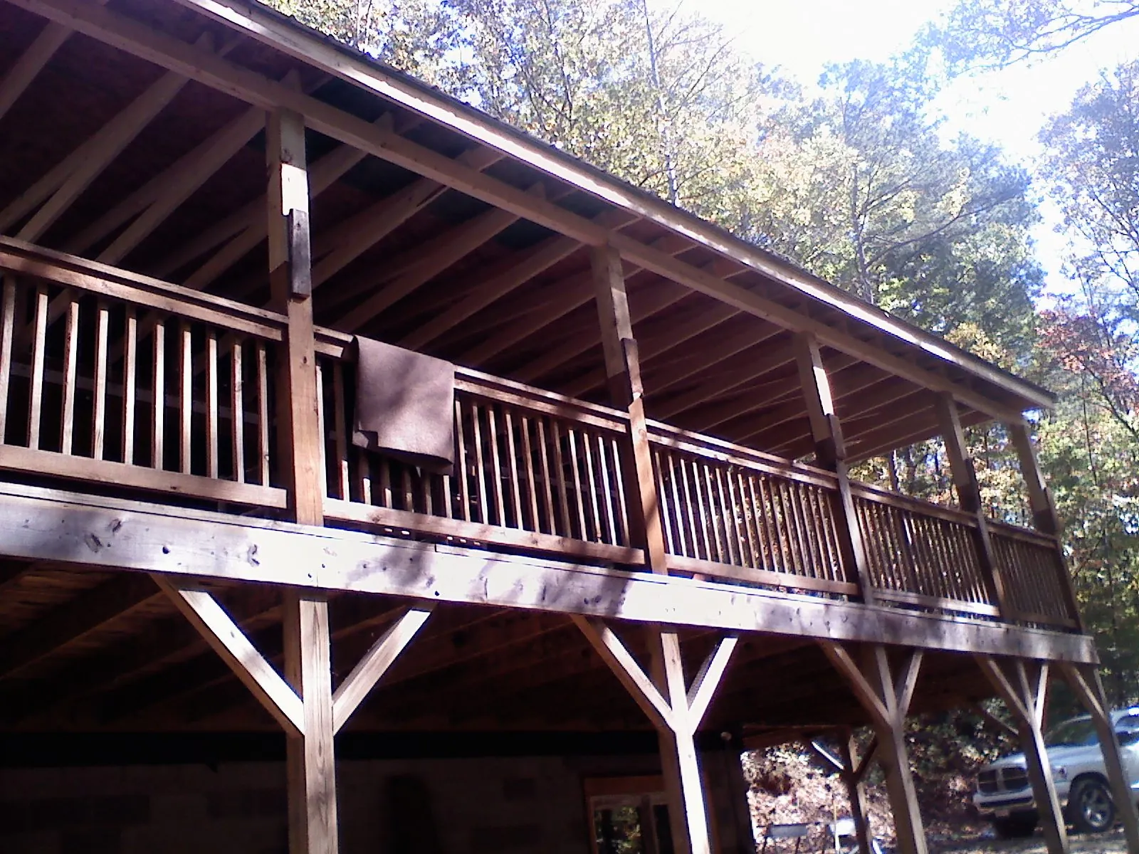 Timber framing under a new elevated porch and deck in Rochester